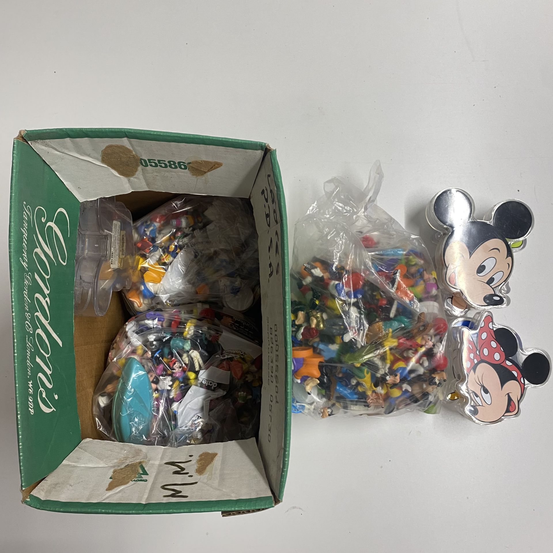 A large collection of Disney characters including Mickey Mouse, Donald Duck and Goof