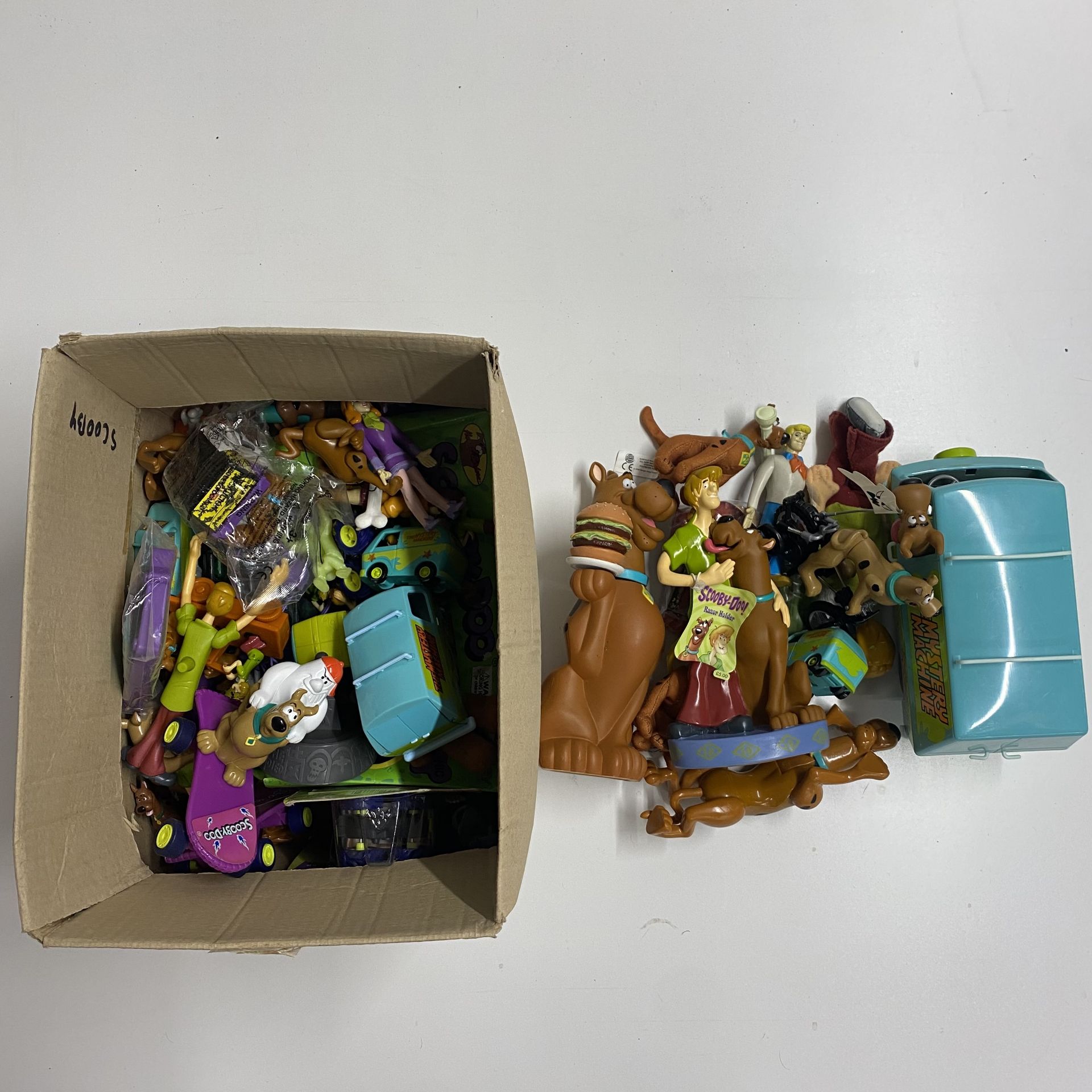 A collection of Scooby Doo toys and figures by Hanna Barbera.