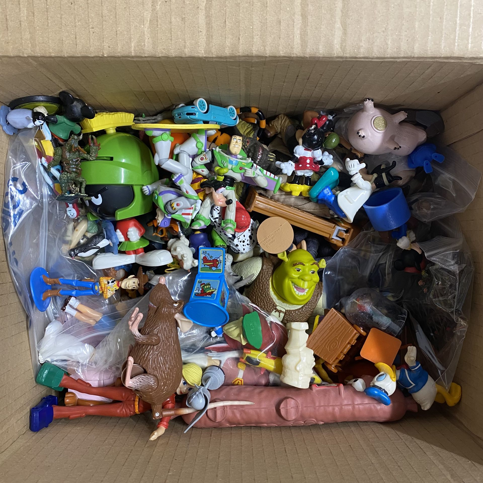 A box containing a large quantity of various Disney characters and others. - Image 2 of 2