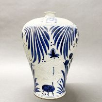 A large Chinese incised and hand painted provincial porcelain vase, H. 38cm.