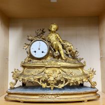 A 19thC French gilt bronze mantle clock on a gilt wooden base, H. 38cm.