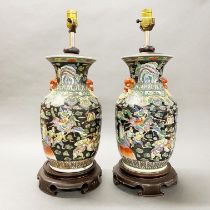 A pair of Chinese hand enamelled porcelain vases mounted as table lamp bases, H. 56cm.