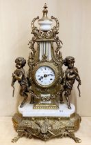 A large French brass and marble mantle clock, H. 61cm.