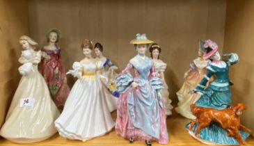 A group of eight Royal Doulton and Coalport figures of ladies.