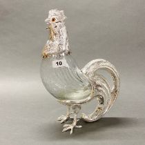 An impressive silver plate and cut crystal clarinet water jug, H. 34cm.