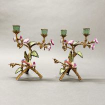 A pair of continental ormulu and porcelain candelabra of humming birds, H. 26cm.