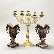 An early 20thC Chinese brass candelabrum, H. 41cm, together with a pair of bronze vases.
