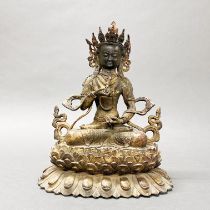 A Tibetan cast bronze figure of a seated Tara, H. 32cm.