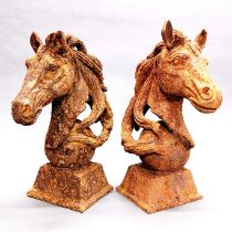 A pair of cast iron garden horse heads, H. 48cm.