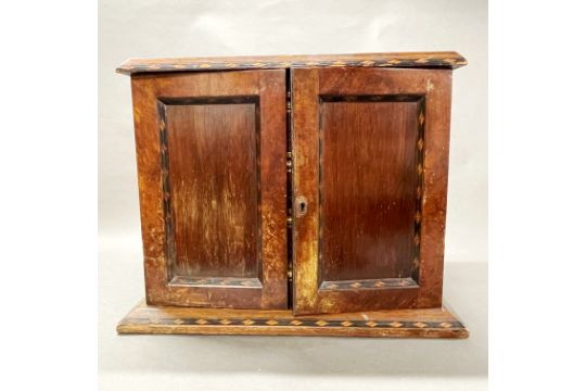 A beautiful 19thC marquetry decorated cabinet with twelve drawers faced with walnut, W. 47cm H. - Image 1 of 5