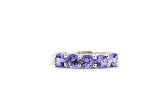 A 9ct white gold half eternity ring set with tanzanites, N. - Image 1 of 2