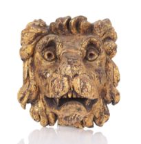 AN 18TH CENTURY CARVED GILT WOOD LION MASK