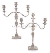 A PAIR OF GEORGE III SILVER CANDLESTICKS