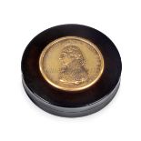 A CIRCULAR TORTOISESHELL SNUFF BOX COMMEMORATING ADMIRAL LORD NELSON, CIRCA 1805