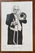 WW2 D-Day, Arnhem, actor Jimmy Edwards DFC signed 6 x 4 inch b/w photo, playing trombone. James