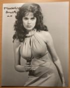 Madeline Smith James bond actress signed sexy 10 x 8 inch b/w photo with gun in hand. Good