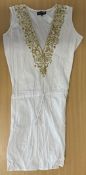 Paris Hilton owned White tunic dress with gold trim has accompanying images of Hilton wearing the