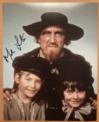 Oliver Mark Lester signed unusual 10 x 8 inch colour photo with Fagin. Good condition. All