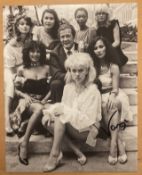 Vanya James Bond signed 10 x 8 inch b/w Bond Girls with Roger Moore photo. Good condition. All