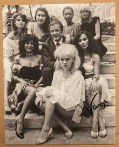 Vanya James Bond signed 10 x 8 inch b/w Bond Girls with Roger Moore photo. Good condition. All