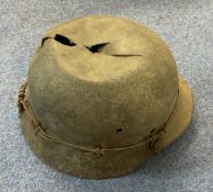 WW2 German Helmet with wire, Has a large hole and split in a dented top, no liner or chin strap.