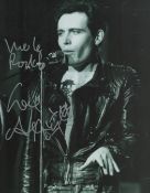 Adam Ant signed black and white photo shown in performance. Dedicated. An English singer,