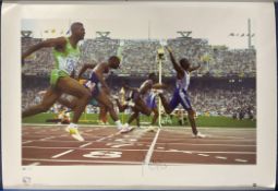 Linford Christie signed 22x16 colour Team GB Olympic Gold Big Blue Tube print. Linford Christie