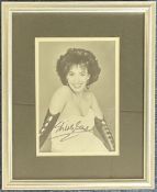 Music. Shirley Bassey Signed black and white photo, housed in a silver effect frame measuring 11 x 9