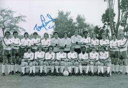 Tony Currie signed 12x8 black and white photo pictured in England squad photo. Good condition. All