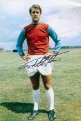 Sir Geoff Hurst signed 12x8 colour photo pictured in West Ham United kit. Good condition. All