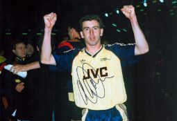 Nigel Winterburn signed 12x8 colour photo pictured during his playing days with Arsenal F. C. Good