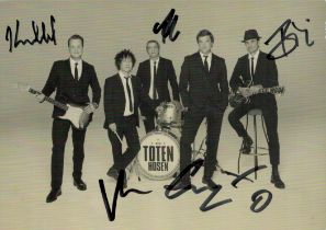 Die Toten Hosen multi signed 6x4inches black and white photo.. Good condition. All autographs come