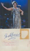 Shirley Bassey signed album page. Marking to page where label was. Good condition. All autographs