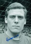 Gordon West signed 12x8 inch vintage black and white photo pictured during his playing days with