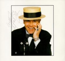 Elton John signed 8x8 inch Sothebys's collection colour photo. Good condition. All autographs come