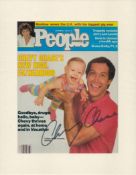 Chevy Chase signed 14x11 inch overall mounted magazine cover page dated September 12, 1983. Good