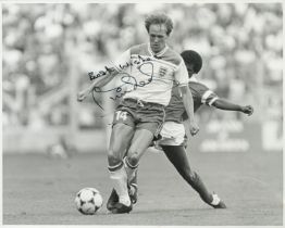 Phil Neal signed 10x8 inch black and white photo pictured in action for England during the 1982