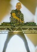 Fatboy Slim signed colour 12x8inch photo. Good condition. All autographs come with a Certificate