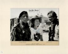 Roger Moore signed 14x11 inch overall mounted original Wild Geese black and white photo inscribed