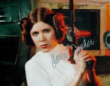 Carrie Fisher signed 10x8 inch Star Wars colour photo. Good condition. All autographs come with a