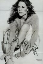 Sheryl Crow signed 12x8 inch black and white magazine photo. Good condition. All autographs come
