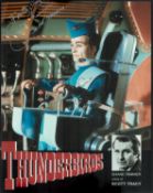 Shane Rimmer signed Scott Tracey Thunderbirds 10x8 inch colour photo. Good condition. All autographs
