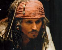 Johnny Depp signed 10x8 inch Pirates of the Caribbean colour photo. Good condition. All autographs