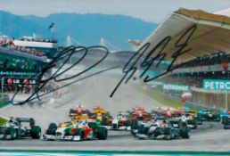 Michael Schumacher and Adrian Sutil signed 7x5 inch Formula One colour photo. Good condition. All
