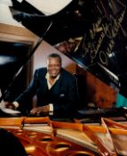 Oscar Peterson signed 10x8 inch colour photo dedicated. Good condition. All autographs come with a