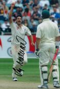 Sajid Mahmood signed 12x8 inch colour photo pictured while in action for England in test match