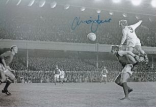 Autographed MICK JONES 12 x 8 Photograph : B/W, depicting a superb image showing Leeds United's MICK