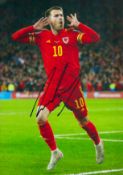 Aaron Ramsey signed 12x98 inch colour photo pictured celebrating while playing for Wales. Good