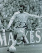 Paul Reaney signed 10x8 inch black and white photo pictured in action for Leeds United. Good