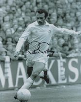 Paul Reaney signed 10x8 inch black and white photo pictured in action for Leeds United. Good